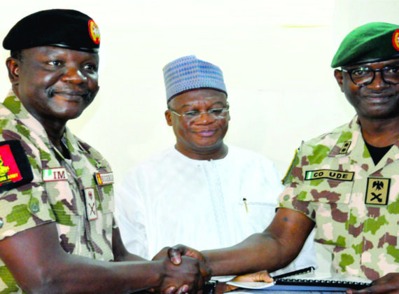 The Outgoing Force Commander Major General CO Ude presents his Handing Over Notes to Incoming FC Major Generak IM Yusuf in the presence of the Heads of Mission MNJTF Ambassador Mamman Nuhu